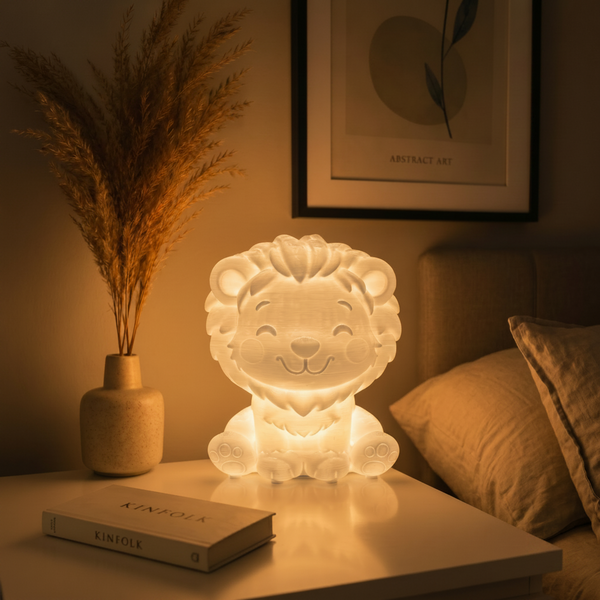 Lion-shaped night light on a table with a book and decorative plant in a warm, cozy setting.